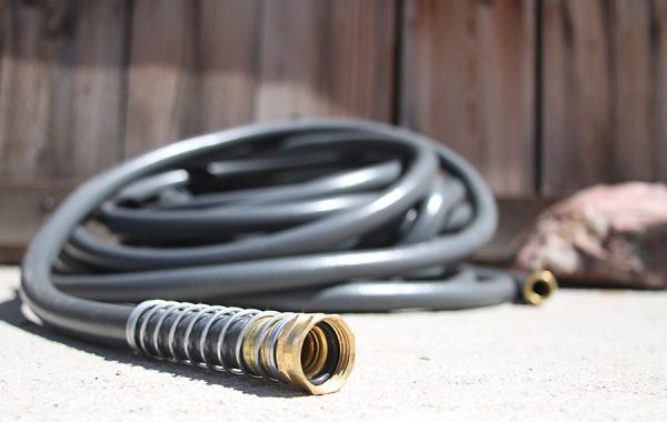 garden hose sitting on concrete